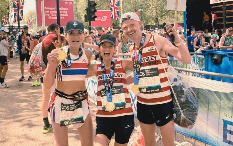 Runners on the London Marathon course near Tower Bridge, targeting Good for Age qualification