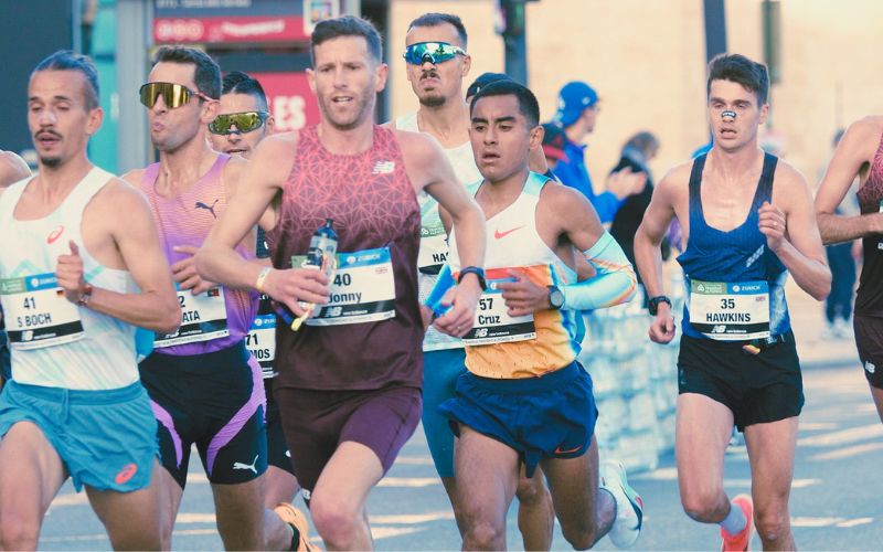 Runner taking an energy gel during a marathon race