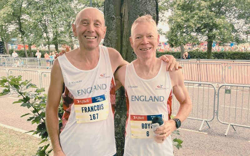 Masters runner in their 40s or 50s completing a marathon race in strong form