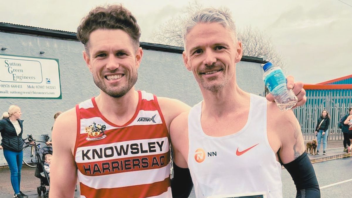 Runner checking race results showing significant improvement in marathon time